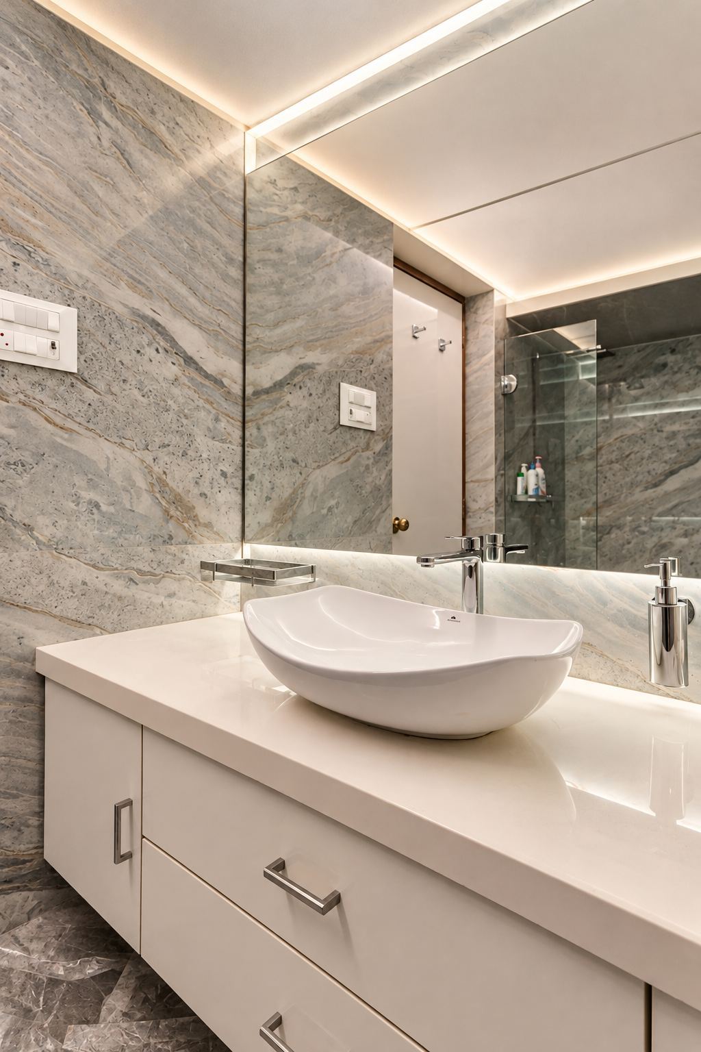 Bathroom in grey stone with a white vanity and a vessel basin
