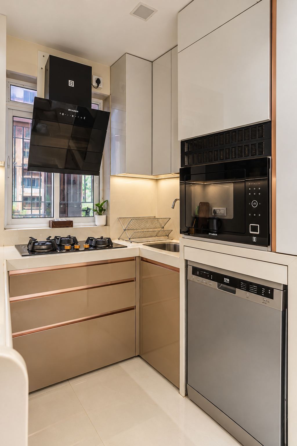 L-shaped kitchen with champagne-taupe units and a built-in oven tower