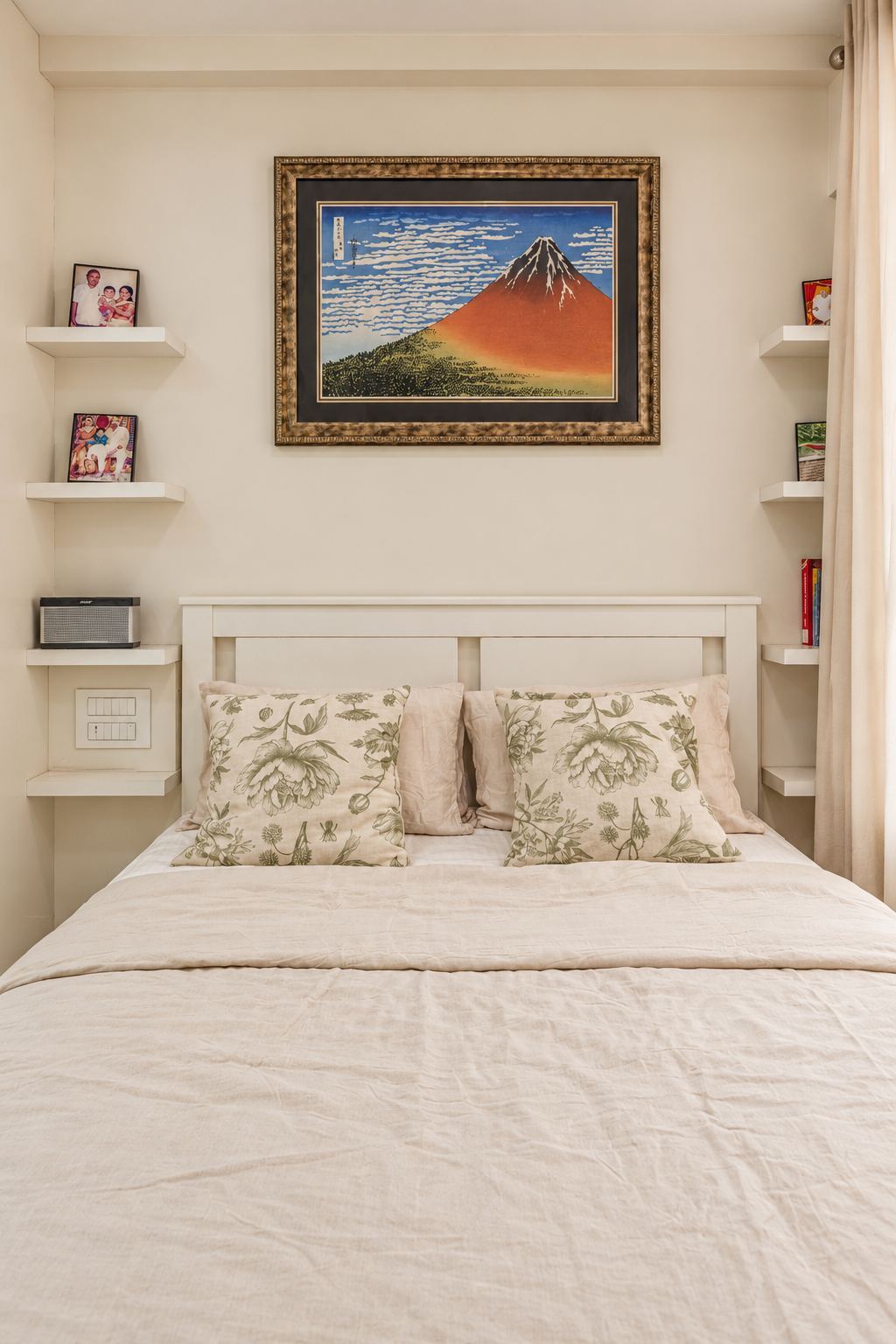 Guest bedroom with a panelled headboard and a Mount Fuji print