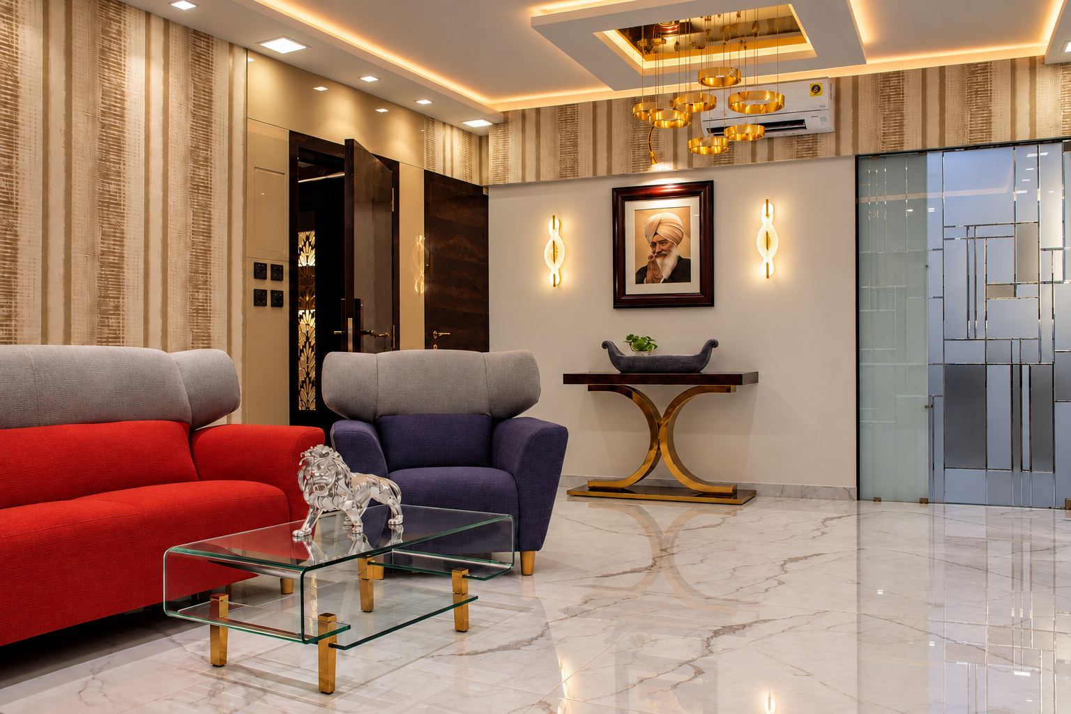 Sitting area with a red sofa, a glass table and a crystal chandelier