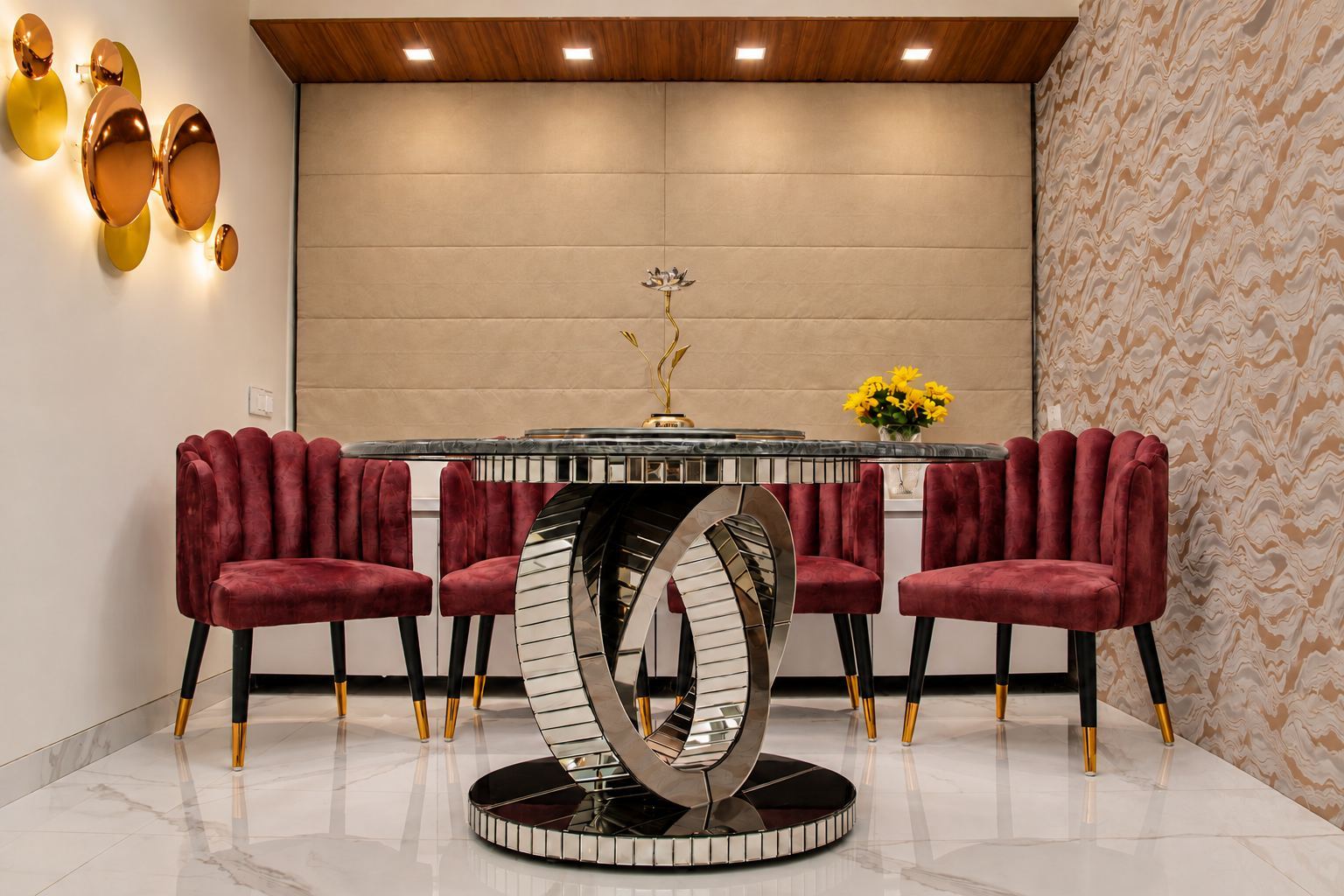 Dining room with burgundy velvet chairs and a quilted upholstered wall