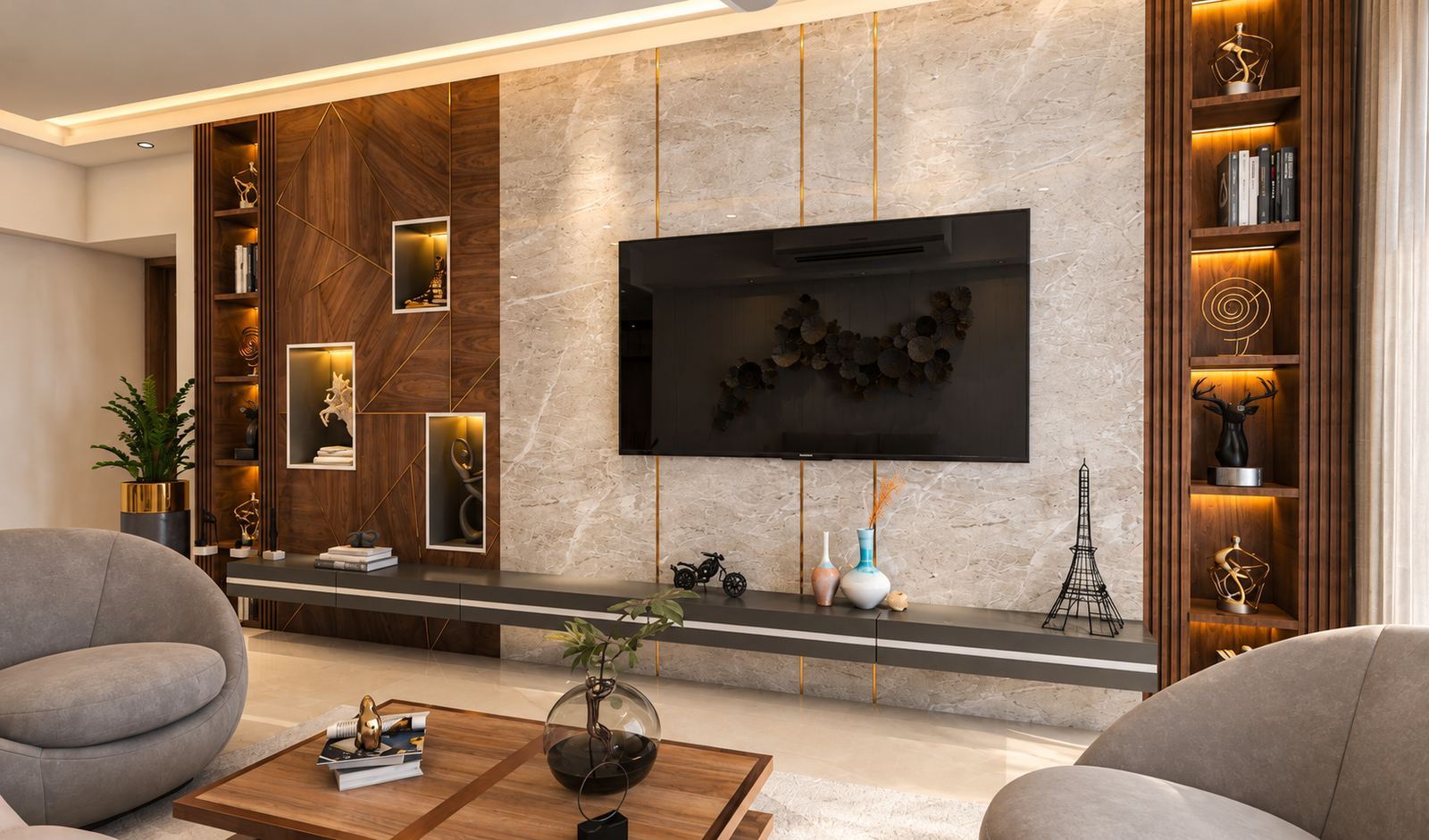 Ivory stone media wall with brass strips and a walnut panel with lit niches